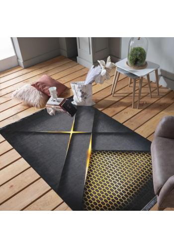 Černý koberec se zlatým vzorem včelího plástve