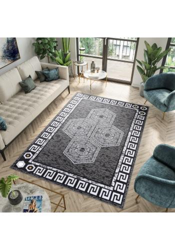 Šedý koberec s bílým vzorem